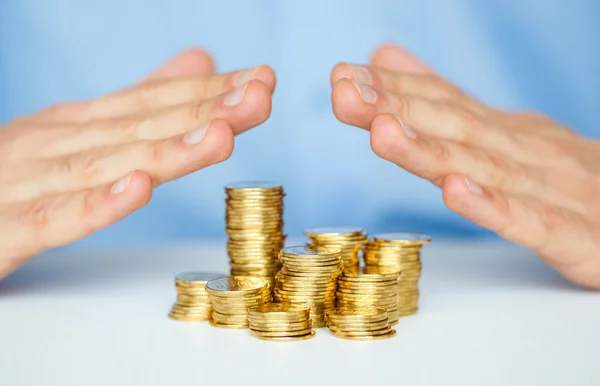 Protect new business start-up concept with hands and coin — Stock Photo, Image