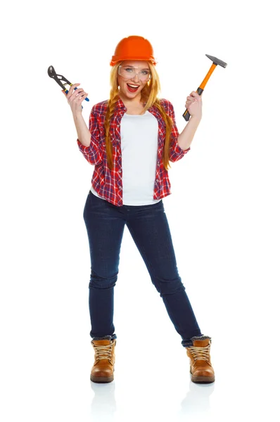 Young woman in helmet with the work tools on a white — Stock Photo, Image