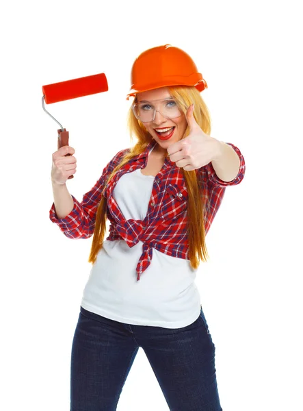 Funny girl in a helmet with roller in hand it is isolated on the — Stock Photo, Image