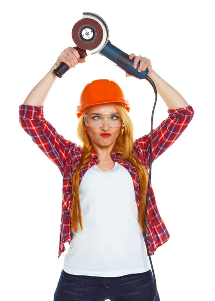 Female construction worker in a hard hat with angle grinder over — Stock Photo, Image