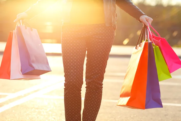 Woman holding her shopping bags in her hand — Stock Photo, Image