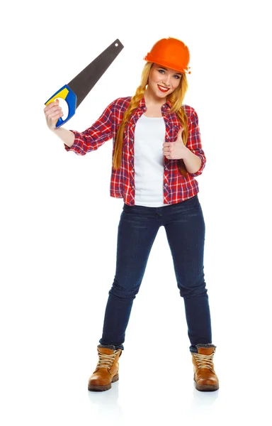 Young funny woman worker in helmet with a saw on a white — Stock Photo, Image