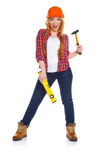 Young woman worker in helmet with the work tools on a white — Stock Photo, Image