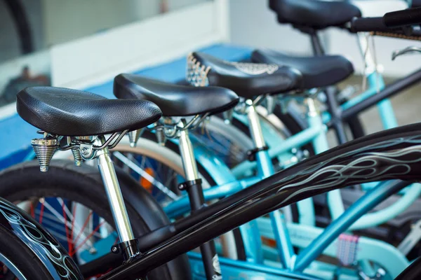 Saddles of a group of bicycles on parking — Stock Photo, Image