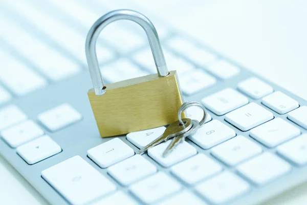 Security lock on white computer keyboard — Stock Photo, Image