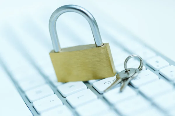 Security lock on white computer keyboard — Stock Photo, Image