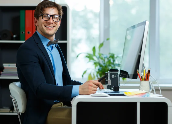 Handsome young man working from home office — Stock Photo, Image