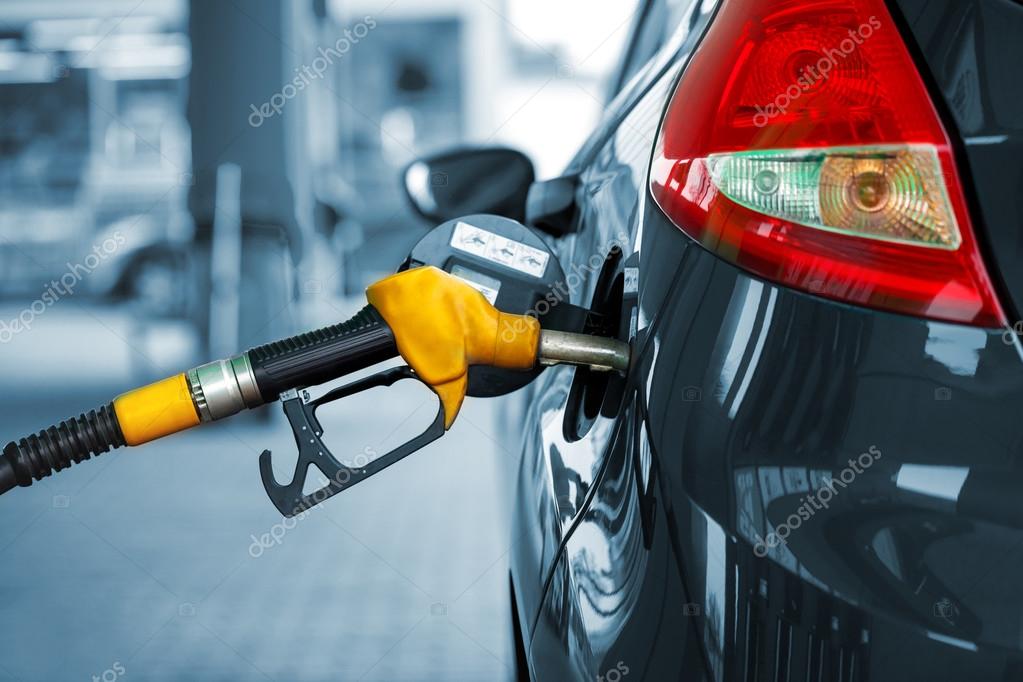 Car refueling on a petrol station Stock Photo by ©vlad_star 117384052
