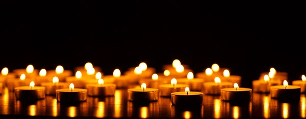 Many burning candles with shallow depth of field — Stock Photo, Image