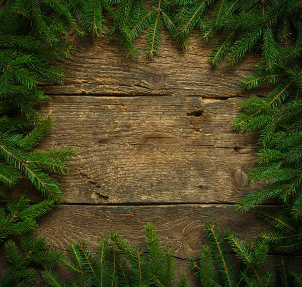 Rami di albero di Natale su texture in legno pronto per il vostro disegno — Foto Stock