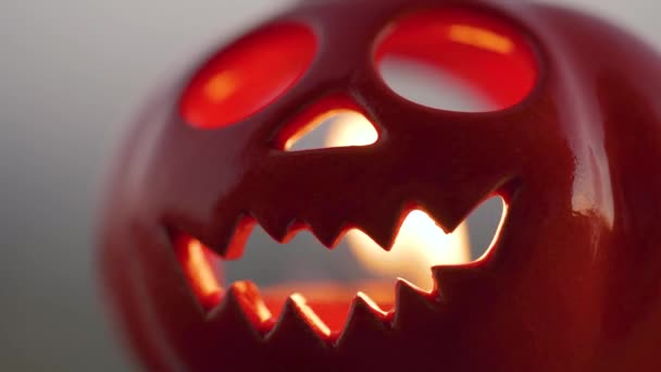 Halloween Jack-o-Lantern with burning candle inside. Halloween symbol. Autumn All Saints Day. — Stock Video