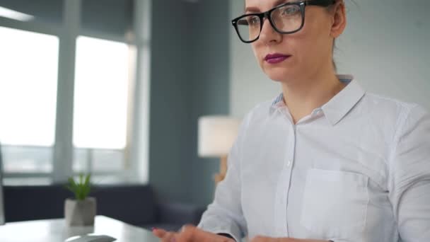 Woman typing on a computer keyboard. Concept of remote work. — Stock Video