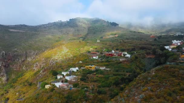 View from the height on the surface of the island of Tenerife - mountain village, winding road, rocky desert landscape. Canary Islands, Spain — Stock Video