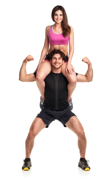 Sport man houdt op schouder een meisje op een wit — Stockfoto
