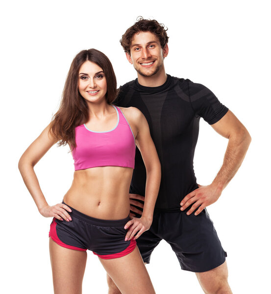 Athletic couple - man and woman after fitness exercise on white