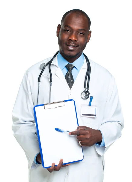 Young male smiling doctor showing clipboard with copy space for — Stock Photo, Image