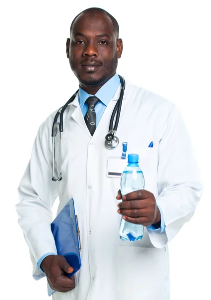 Portrait of a smiling male doctor holding bottle of water on whi — Stock Photo, Image