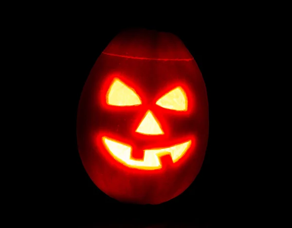 Halloween pumpkin jack-o-lantern candle lit, isolated on black — Stock Photo, Image