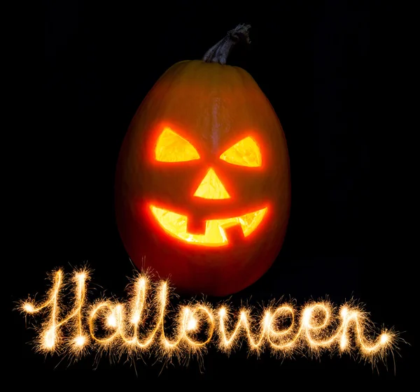 Halloween zucca jack-o-lanterna candela accesa e l'iscrizione — Foto Stock