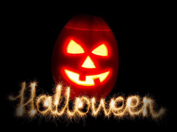 Halloween zucca jack-o-lanterna candela accesa e l'iscrizione — Foto Stock