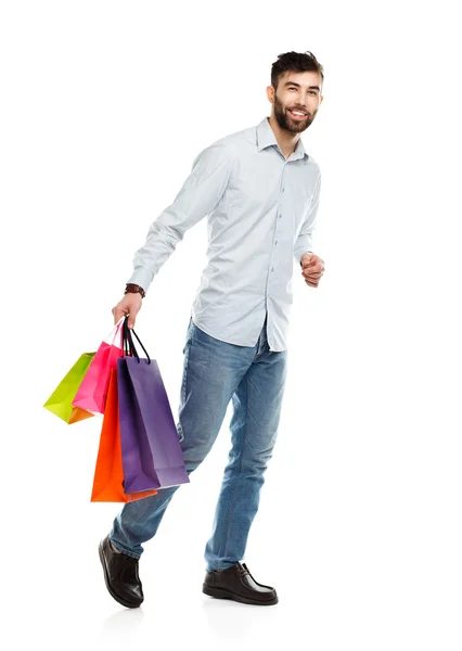 Handsome man holding shopping bags — Stock Photo, Image