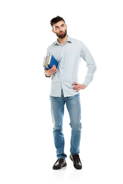 Young bearded smiling man with books in hands on white — Stock Photo, Image