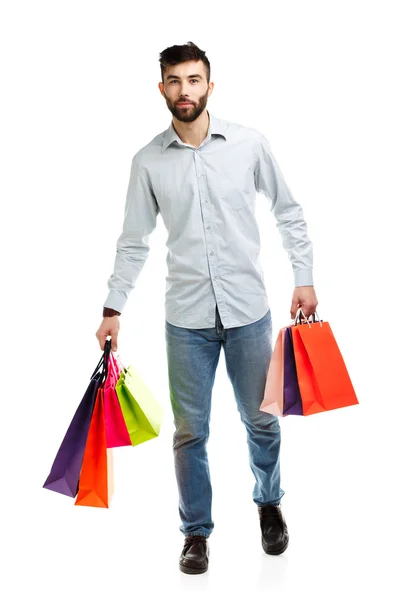 Muž hospodářství nákupní tašky. Vánoce a svátky koncepce — Stock fotografie