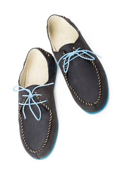 Black men's leather loafers with blue soles and laces on a white — Stock Photo, Image