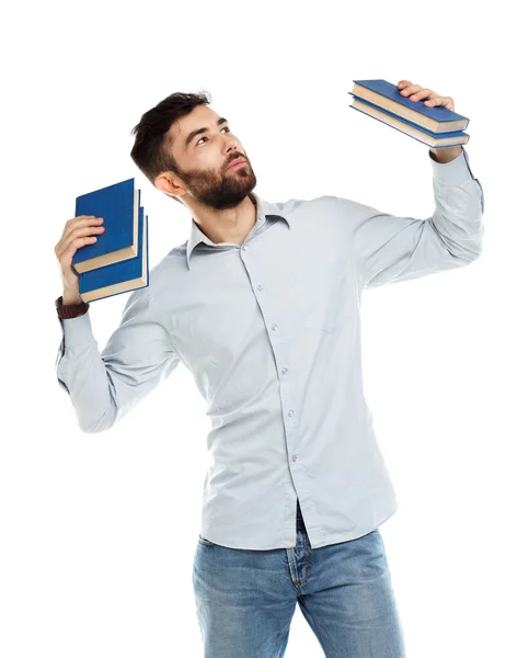Mladé vousatých usmívající se muž s knihami v ruce na bílém pozadí — Stock fotografie