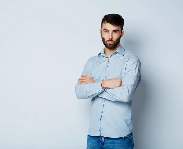 A young man with a serious expression on his face — Stock Photo, Image