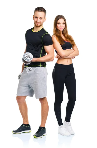 Athletic man and woman with dumbbells on the white — Stock Photo, Image