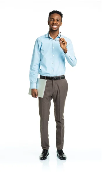 Happy african american college student standing with laptop on w — Stock Photo, Image