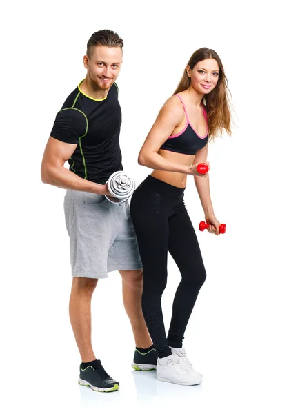 スポーツ カップル - 男と女、白にダンベルを使用 — ストック写真