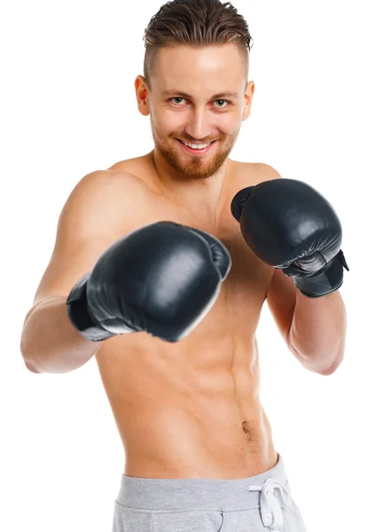 Deporte atractivo hombre usando guantes de boxeo en el blanco — Foto de Stock