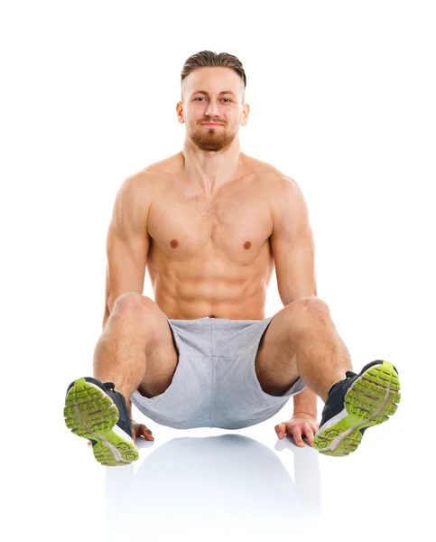 Sport attractive man doing fitness exercises on the white — Stock Photo, Image