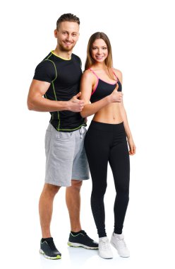 Spor erkek ve kadın fitness sonra bir parmak ile yukarı t üzerinde egzersiz