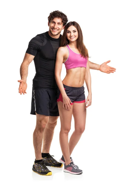 Athletic couple after fitness exercise on the white — Stock Photo, Image