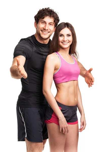 Casal atlético após o exercício de fitness no branco — Fotografia de Stock