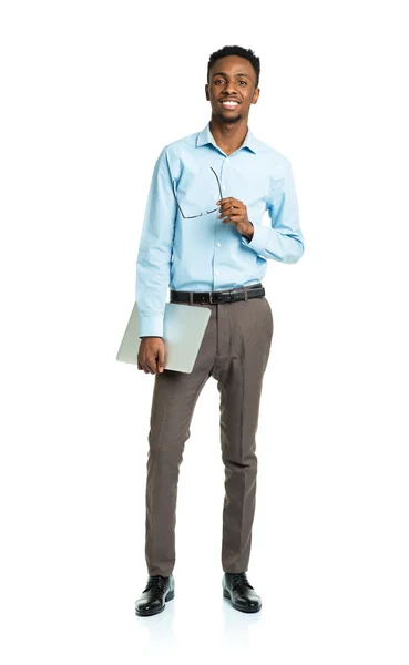 Happy african american college student with laptop standing on w — Stock Photo, Image