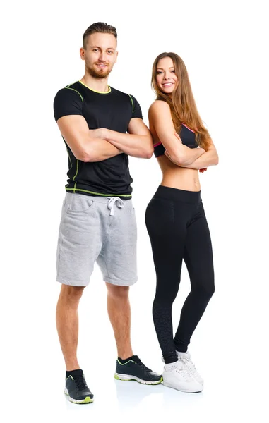 Athletic couple - man and woman after fitness exercise on the wh — Stock Photo, Image