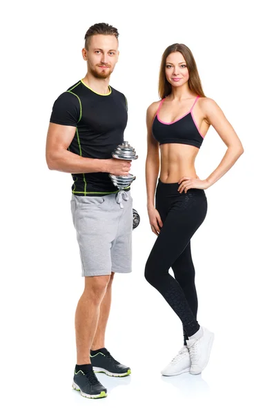 Atletik çift - erkek ve kadın üzerinde beyaz dumbbells ile — Stok fotoğraf