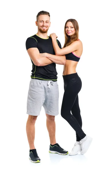 Athletic couple - man and woman after fitness exercise on the wh — Stock Photo, Image