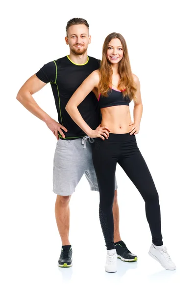 Athletic couple - man and woman after fitness exercise on the wh — Stock Photo, Image