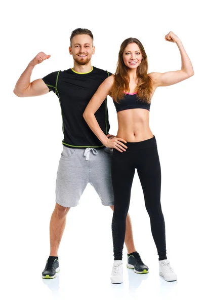 Athletic couple - man and woman after fitness exercise on the wh — Stock Photo, Image