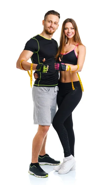 Mutlu atletik çift - erkek ve kadın üzerinde bant ölçme ile ve — Stok fotoğraf
