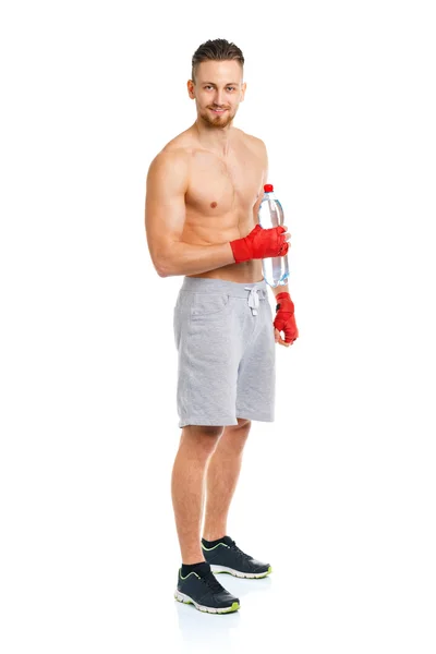 Sport attractive man wearing boxing bandages with bottle of wate — Stock Photo, Image