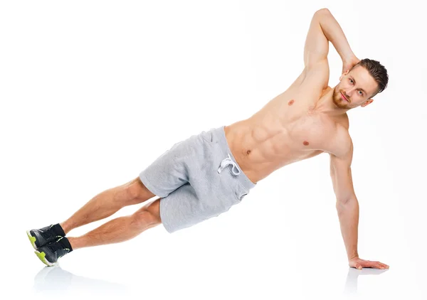 Aantrekkelijke man sport doen fitness oefeningen op de witte — Stockfoto