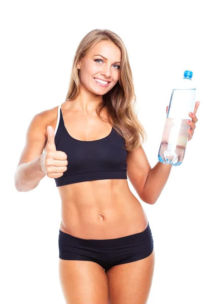 Bir parmak ve şişe suyu whit üzerinde genç atletik kız — Stok fotoğraf
