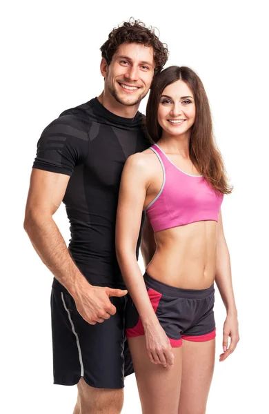 Αθλητισμός ζευγάρι - άνδρας και γυναίκα, μετά την άσκηση γυμναστήριο στο λευκό — Φωτογραφία Αρχείου