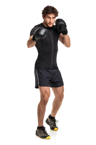 Athletic attractive man wearing boxing gloves on the white — Stock Photo, Image